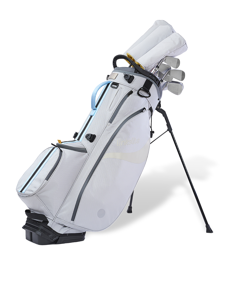 Linkslite Explorer 14-way stand bag in off-white and baby blue, on stand with full set of clubs