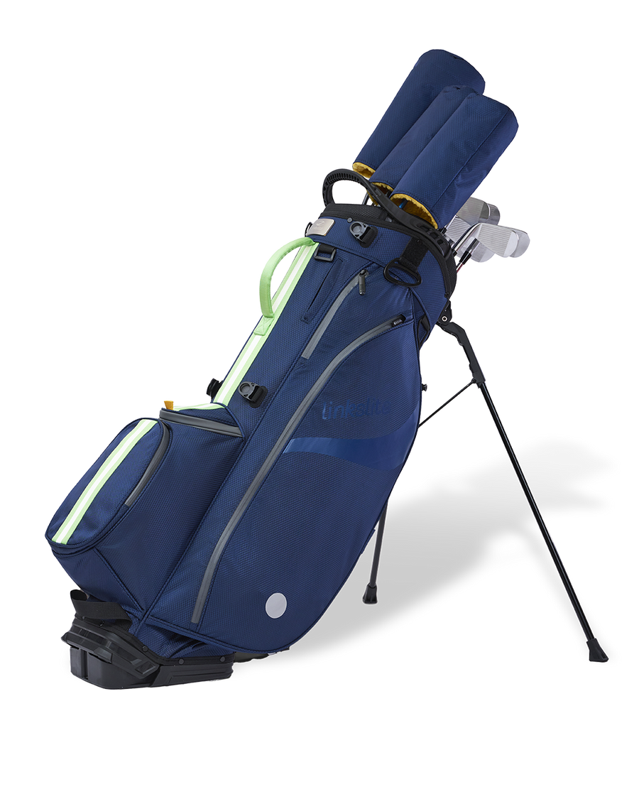 Linkslite Explorer 14-way stand bag in navy and sage, on stand with full set of clubs