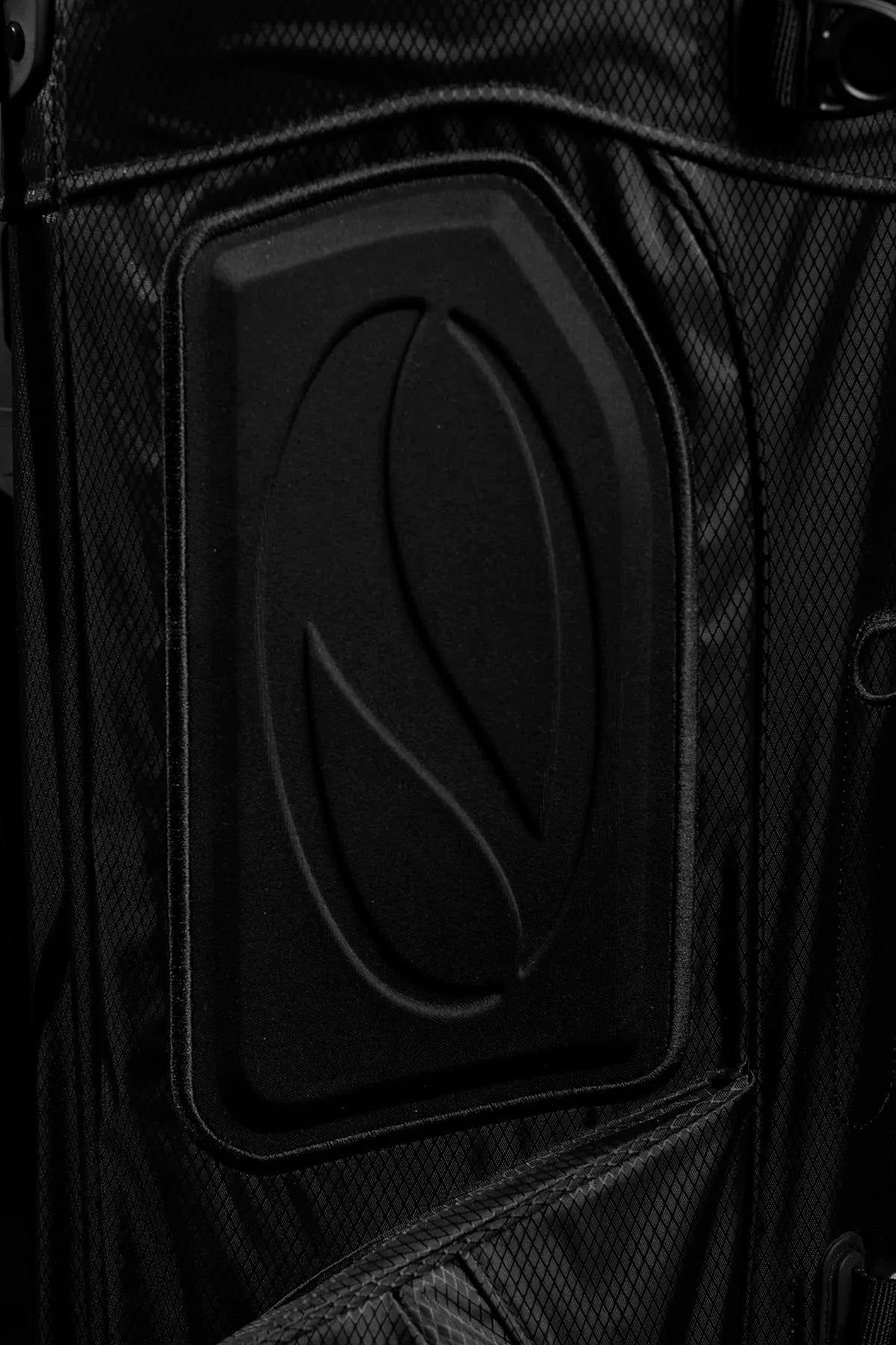 Close-up of The Explorer black stand bag's cushioned hip pad with Linkslite's logo imprinted, designed to protect your back.