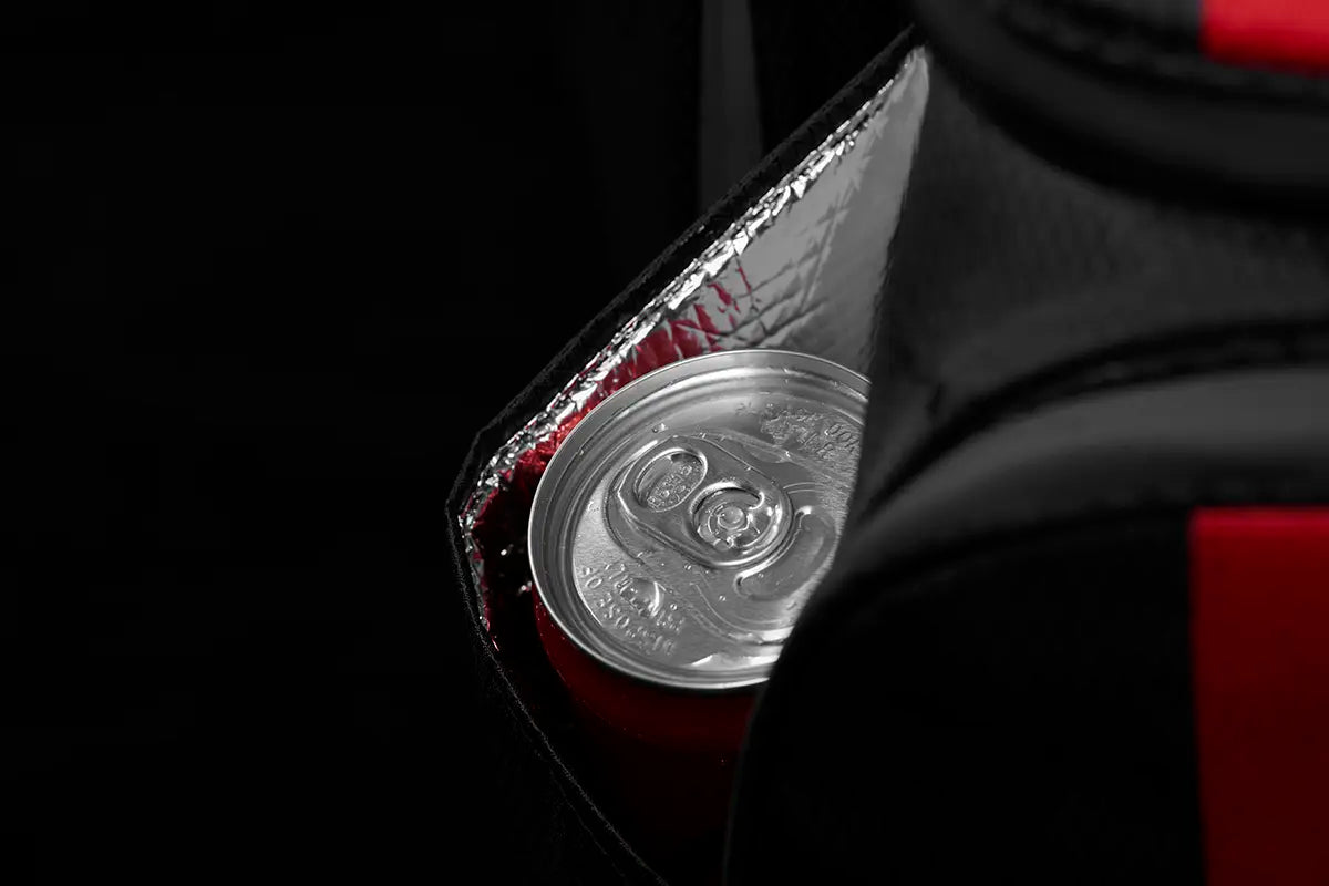 Close-up of the insulated drink pocket on the Linkslite Explorer black golf stand bag, featuring a can stored inside for keeping beverages cool.