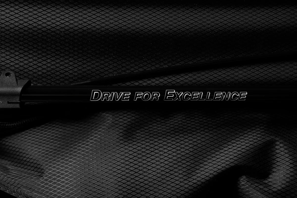 Close-up of Linkslite's slogan "Drive For Excellence" printed on The Explorer black stand bag's leg.